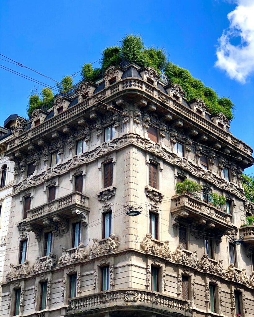 pexels-photo-14809397-14809397 Stunning architectural detail with lush greenery on a historic Milanese building.